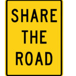 share the road black and yellow road sign share the road black and yellow road sign