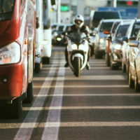 Motorcycle lane splitting in busy traffic