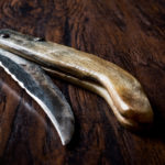 Handmade Wooden Pocket Knife on Dark Surface. Handmade Wooden Pocket Knife on Dark Surface.