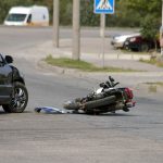 crash moto bike and car on road