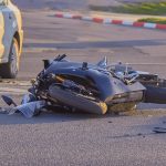 a bike crashed into a car a motorcyclist was injured police investigation fingerprint investigator.