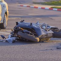 a bike crashed into a car a motorcyclist was injured police investigation fingerprint investigator. a bike crashed into a car a motorcyclist was injured police investigation fingerprint investigator.